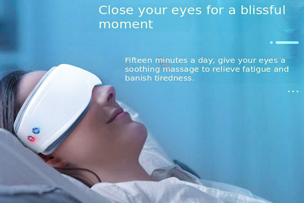 A person relaxing with a modern electronic eye massager over their eyes