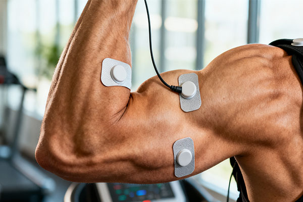 A close-up of a bicep muscle contracting during an EMS session