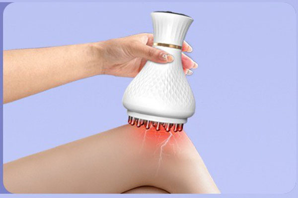 A person holding a sleek, modern meridian massage brush